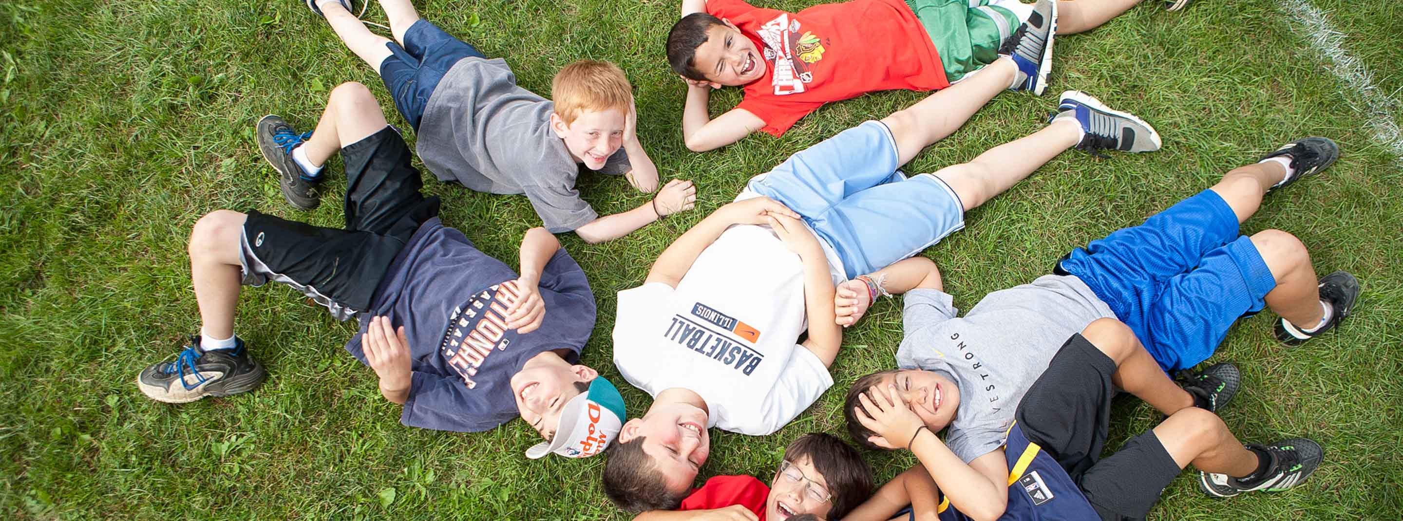 Campers laying on grass